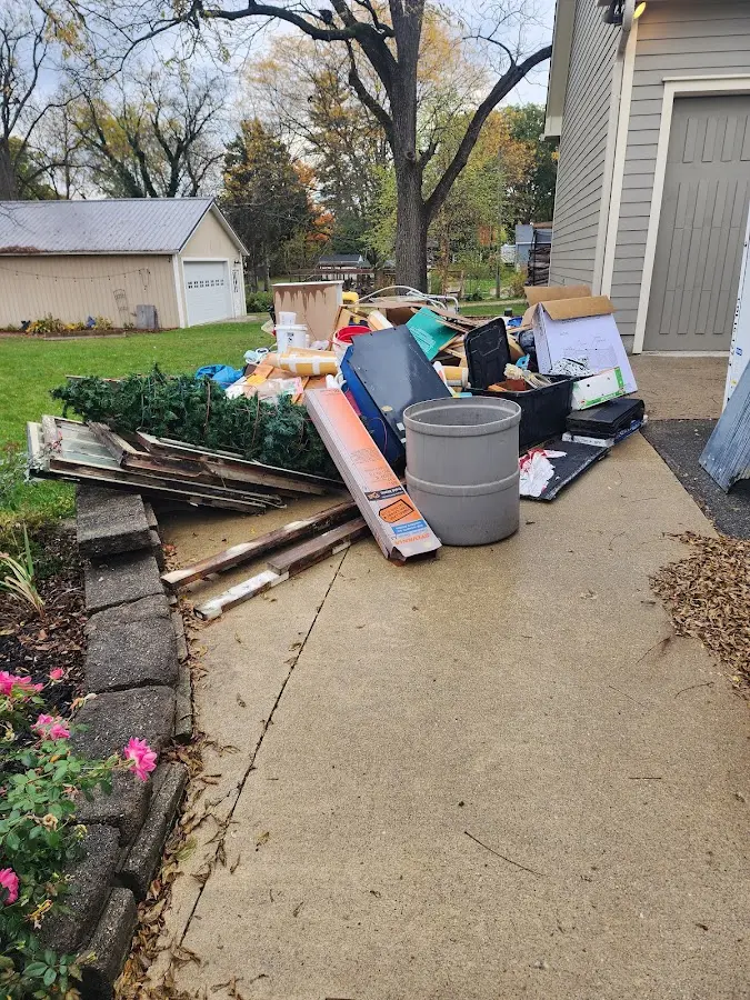 Dumpster being loaded with debris for 3 Yard Dumpster Rental in Bellefonte
